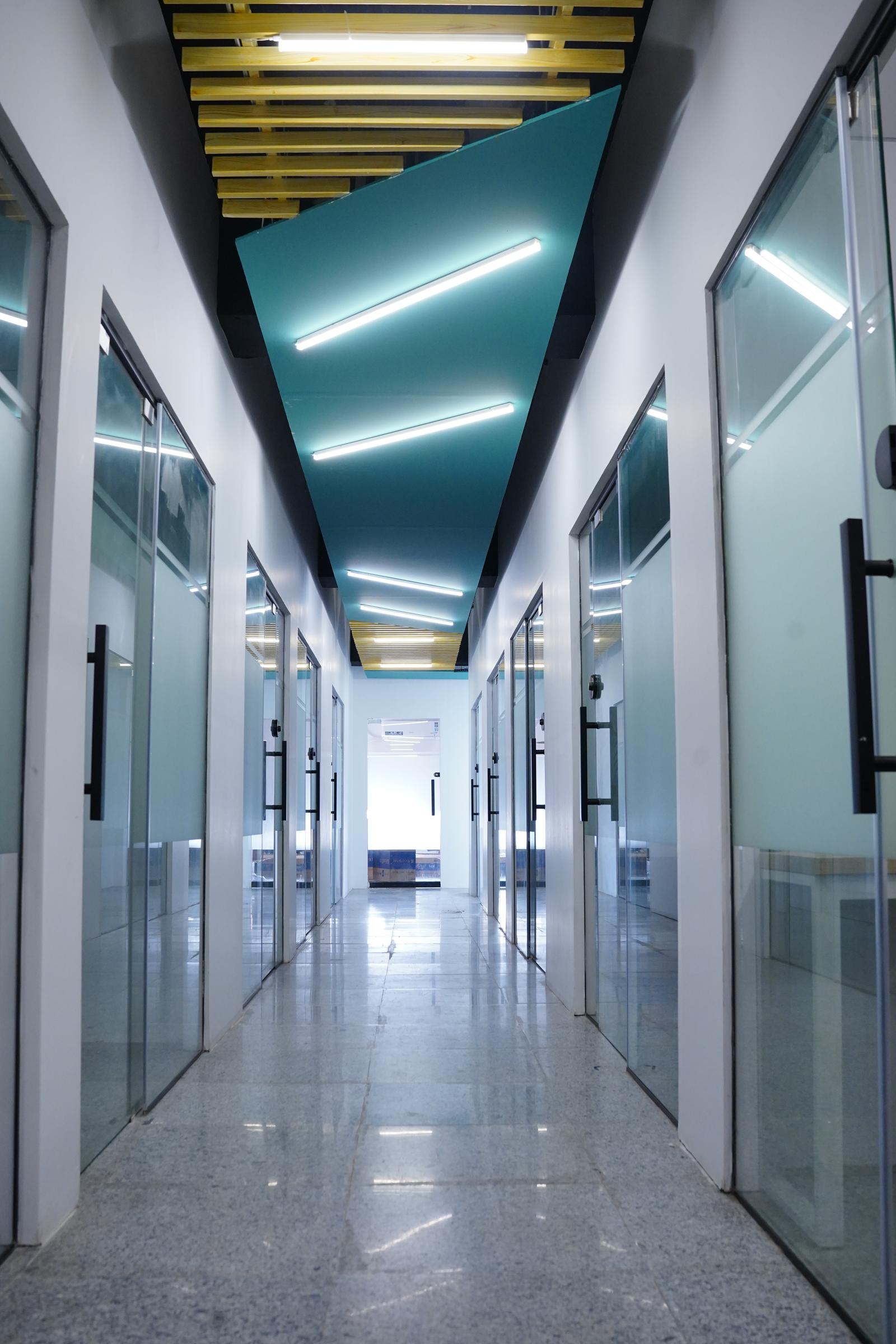 Corridor with private executive and team rooms at WorkX